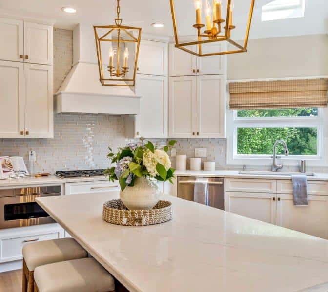 Quartz kitchen island with woven shades in the background