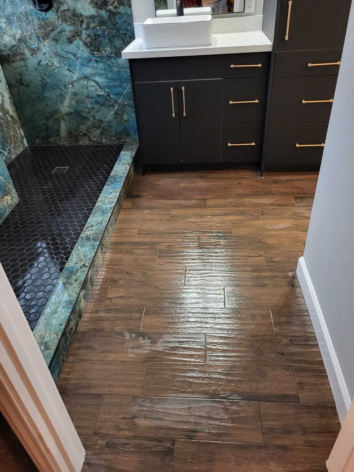 Bathroom remodel: wood look tile teal shower