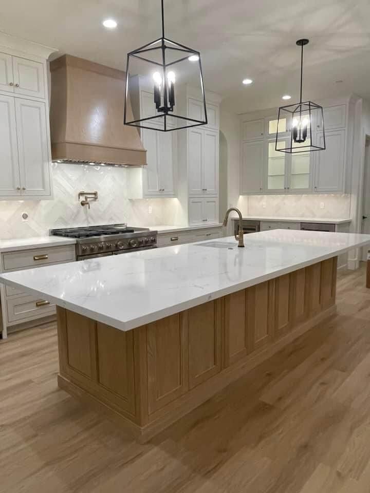 Kitchen remodel: waterfall island black pendants