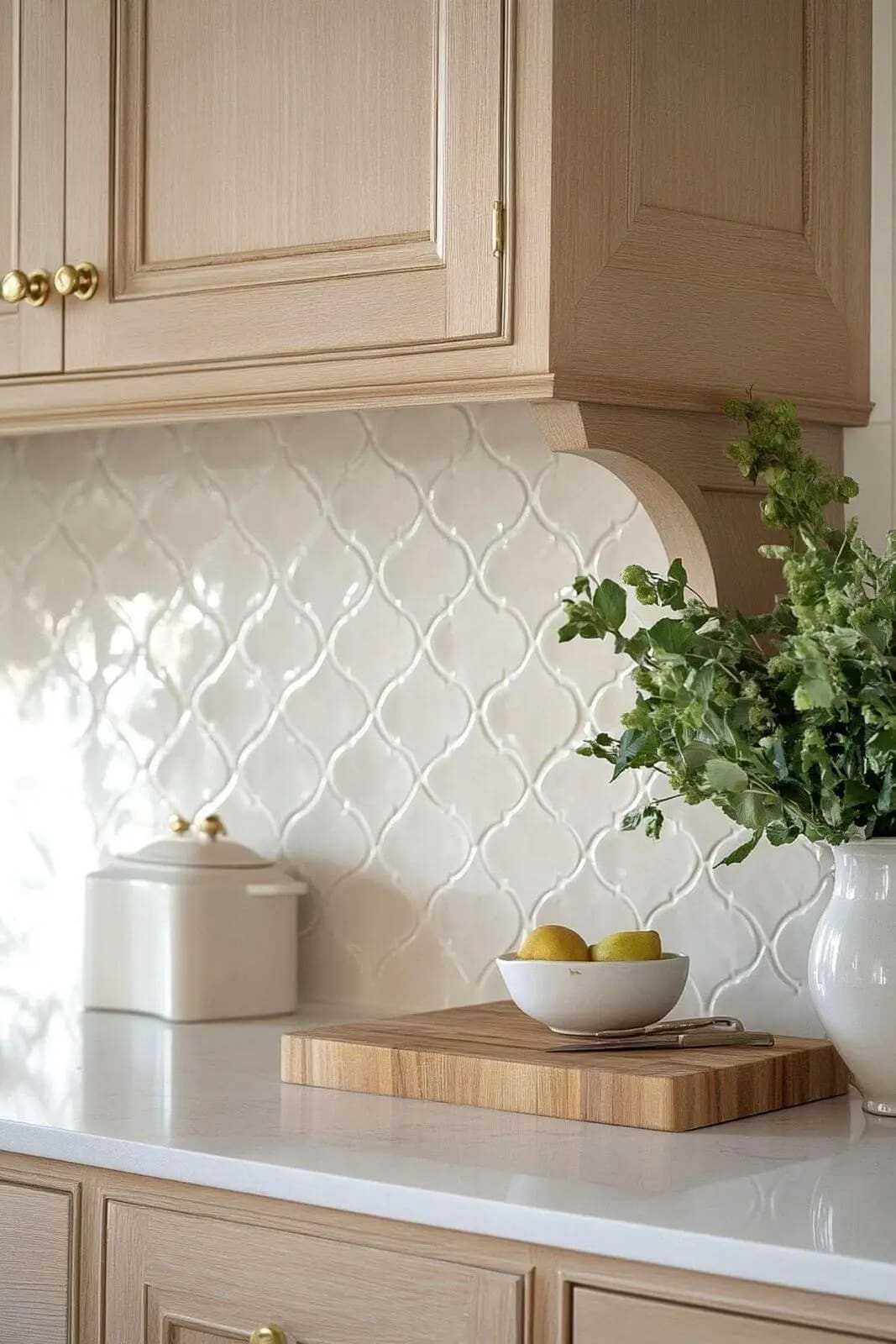 Ornate ceramic tile backsplash above a marble kitchen counter
