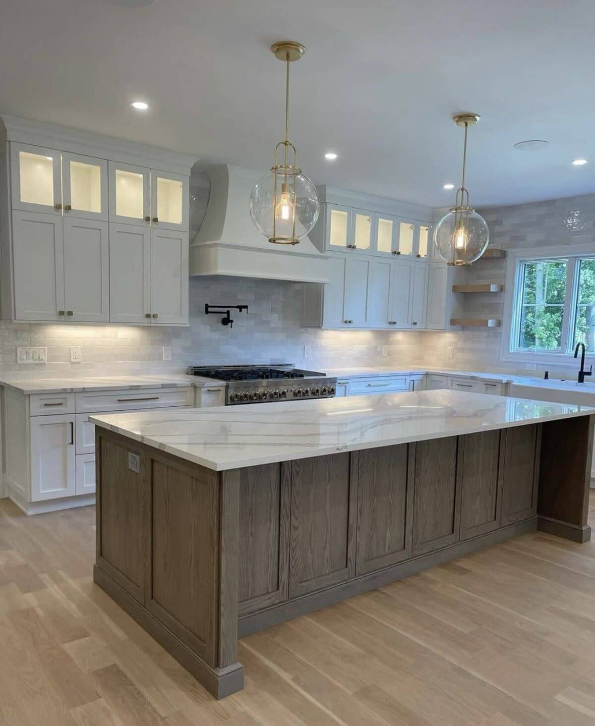Kitchen remodel: dark island white cabinets