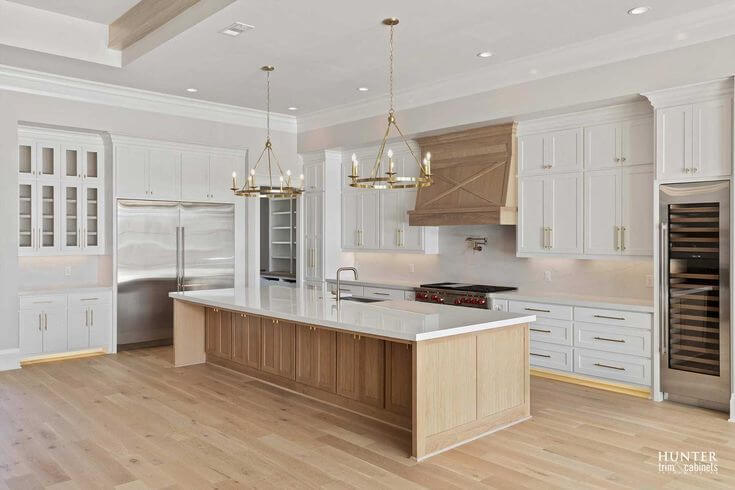 Kitchen remodel: light wood island gold pendants